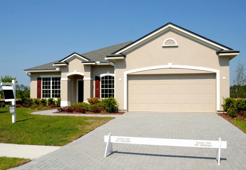 Newer Jacksonville stucco home with a two-car garage